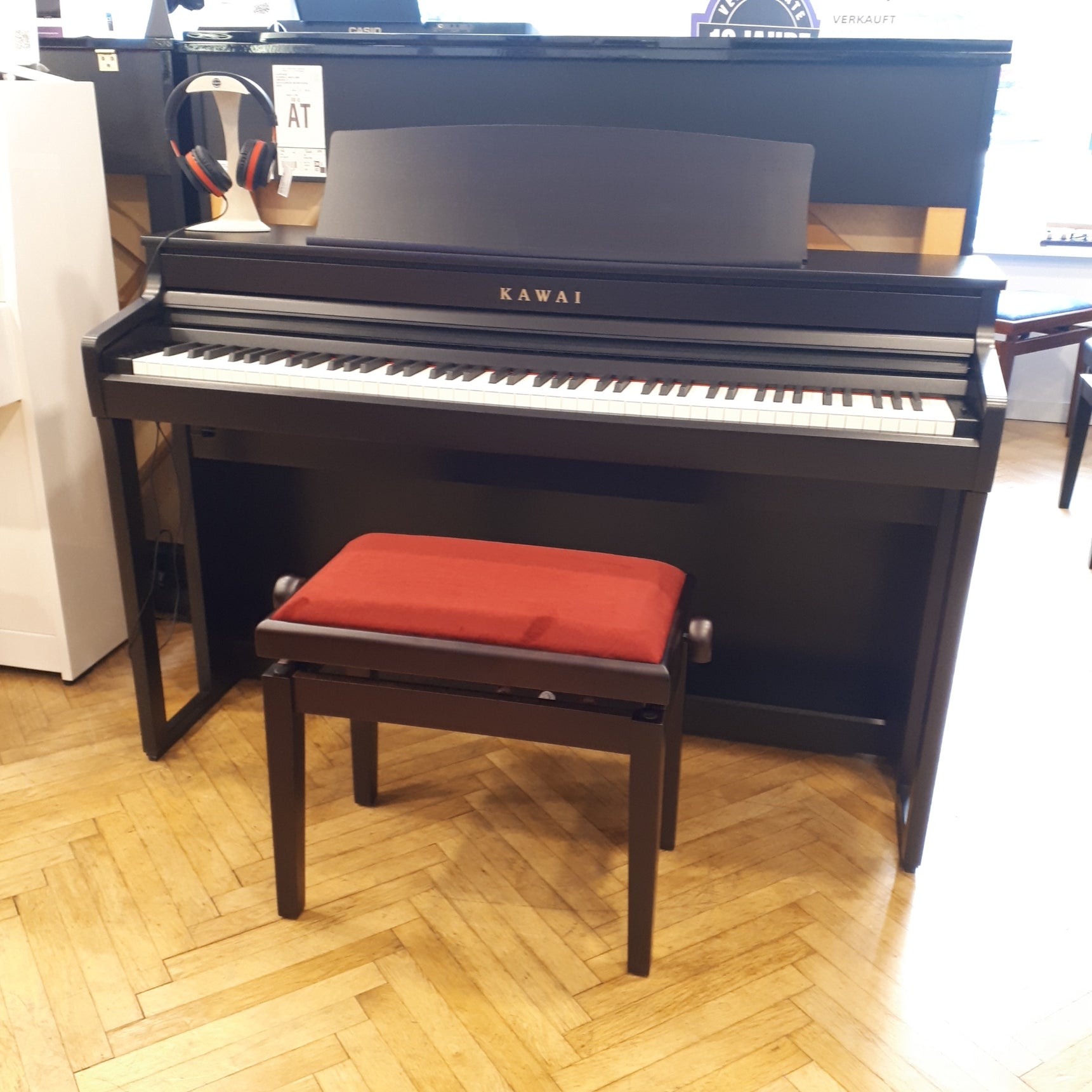 Kawai CA401 Digitalpiano Ausstellungsstück in Rosenholz mit Hocker und Kopfhörer von rechts